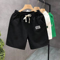 Men's elastic waist sports shorts in solid colours with micro elastic polyester fabric
