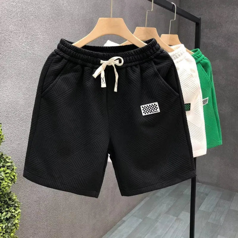 Men's elastic waist sports shorts in solid colours with micro elastic polyester fabric