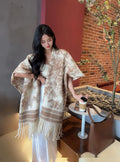 Women's polyester tassel scarf cape in a picture colour, worn as a casual shawl.