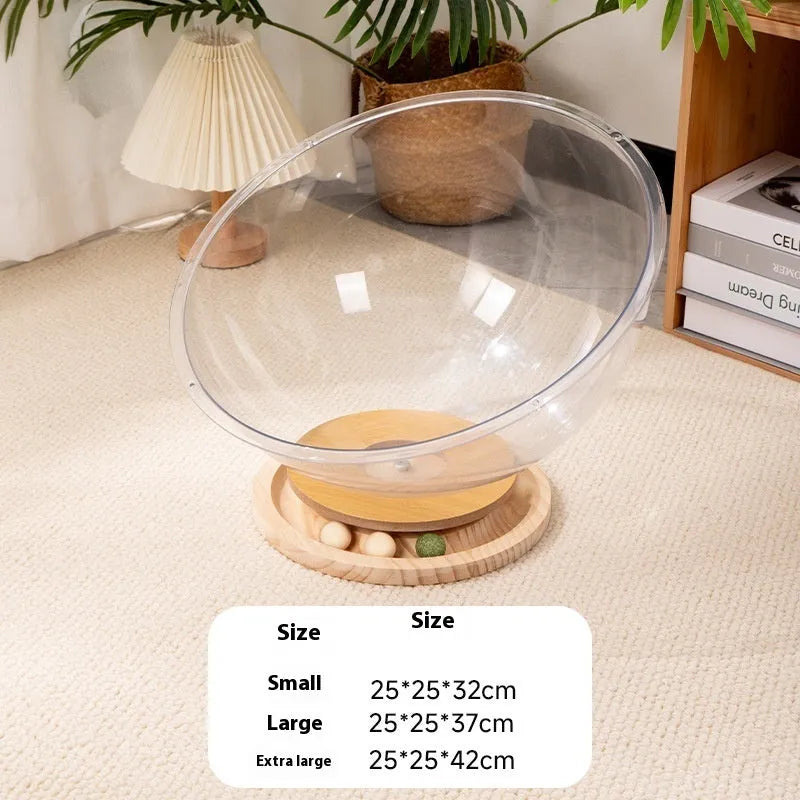 Transparent acrylic space capsule-shaped cat bed on a turntable base.
