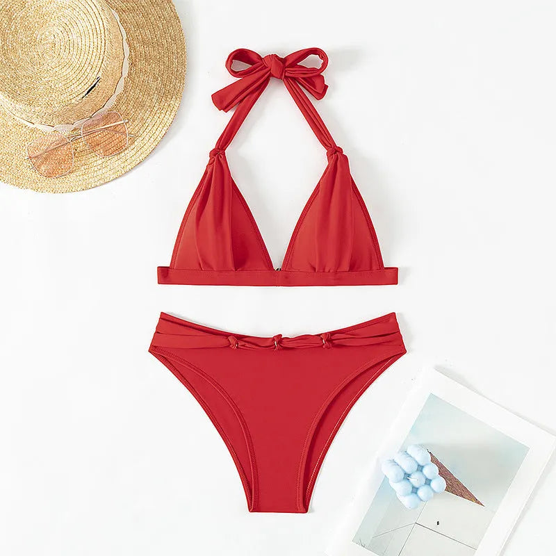 Red women's lace-up halterneck bikini set with split beach style shorts