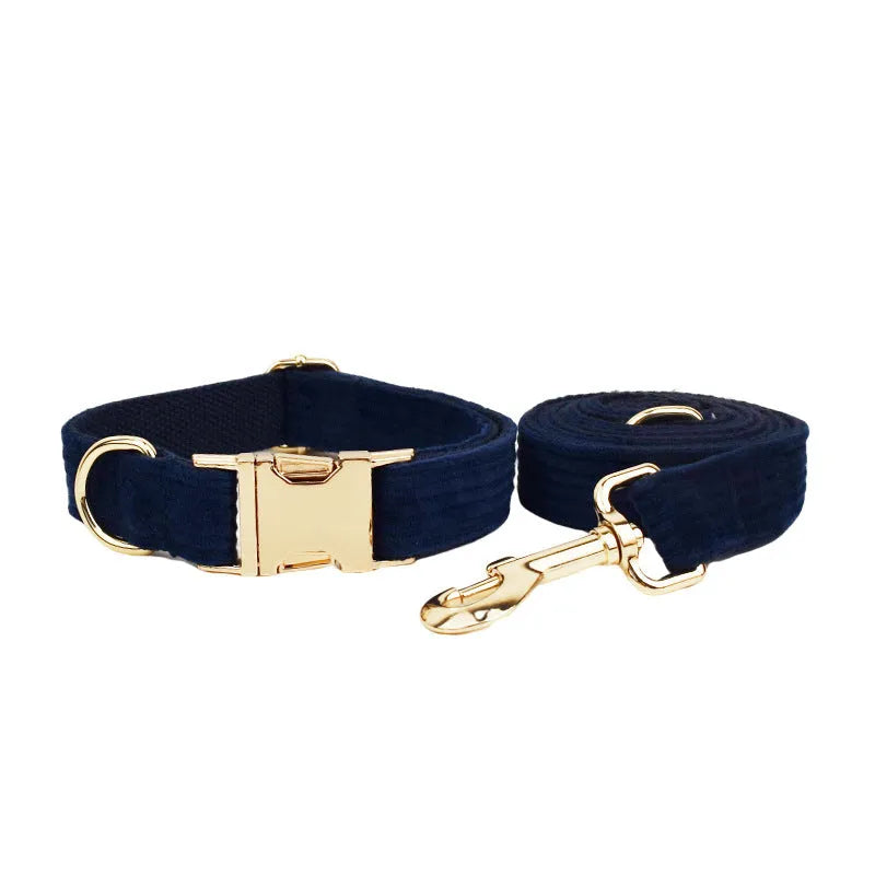 Navy blue corduroy dog collar set with matching leash, vest, bow, and poop bag