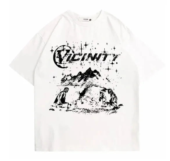 Man wearing a retro-style hip hop graphic print t-shirt in a casual setting.