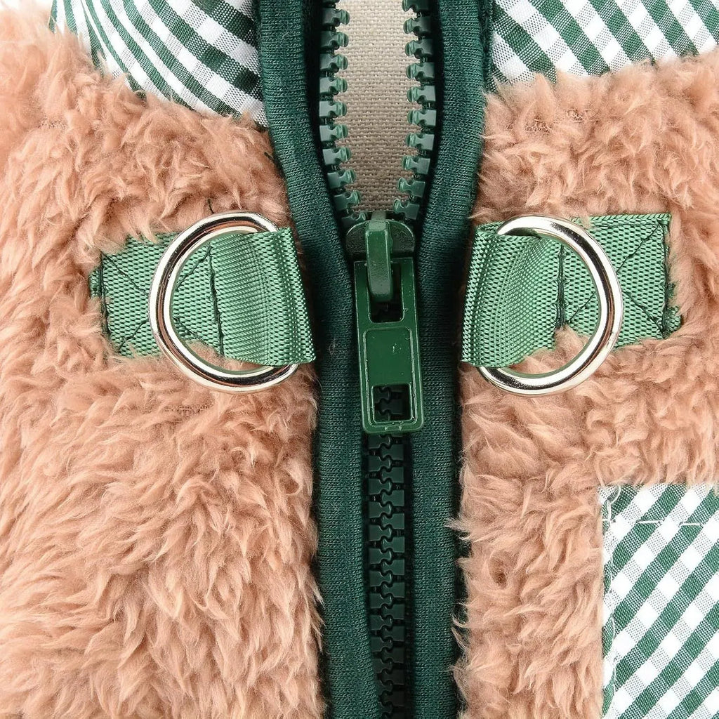 Green fleece dog coat with four-leg jumpsuit design and back zipper closure on a small dog
