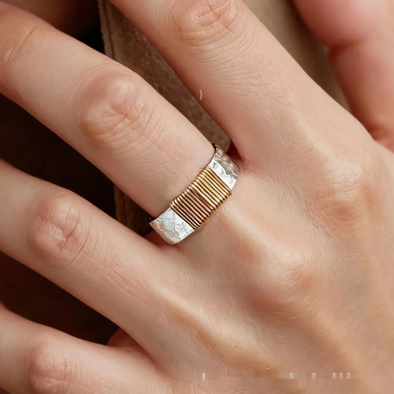 Copper geometric ring with silver golden electroplated finish and irregular vintage coil design.