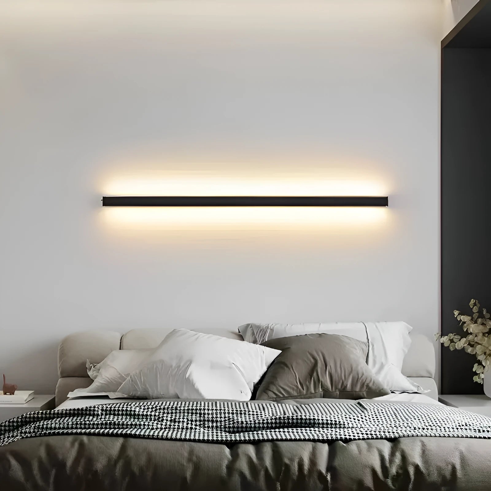 80cm long black aluminium LED strip wall lamp with a PC light shade mounted on a wall.