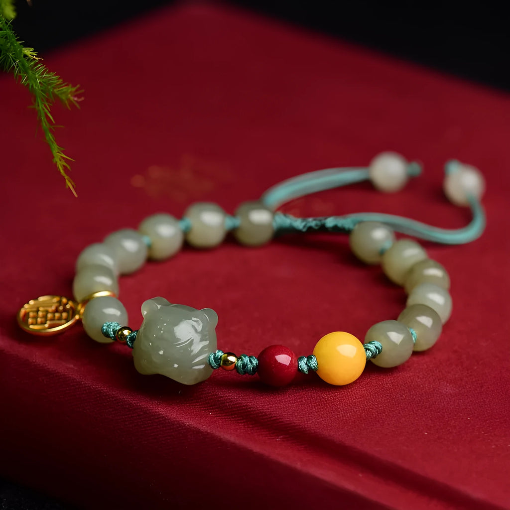 Natural Hetian jade and cinnabar beeswax bead bracelet with animal zodiac design, bead size 5x7mm.