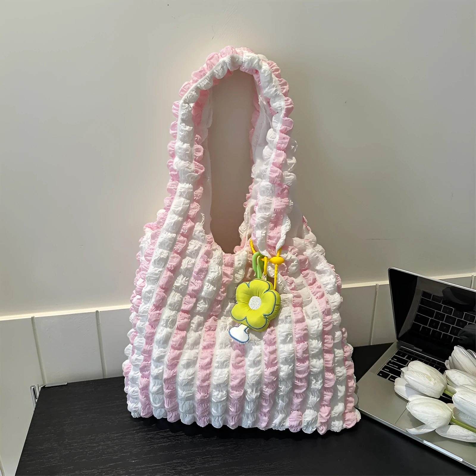 Women's soft pleated bubble shoulder bag in a vertical square shape with a pendant, shown in one of five colour options.