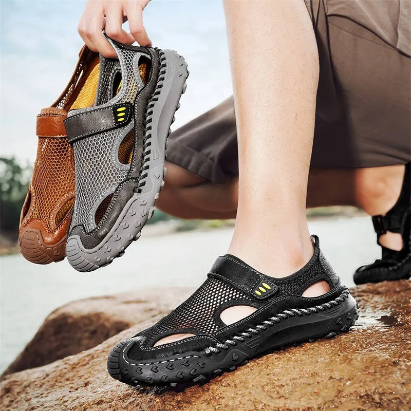 Men's black mesh sandal with Velcro strap on a rubber sole