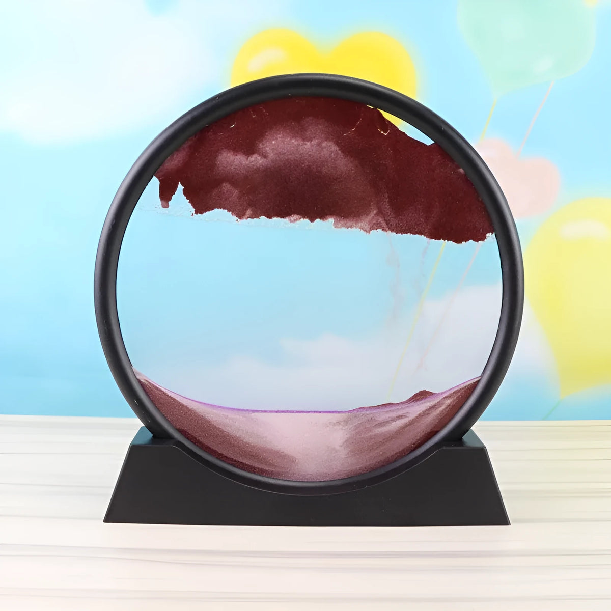 3D dynamic sand painting in glass frame with shifting blue and purple sand patterns