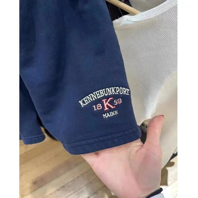 Women's dark blue cotton sports shorts with white flag embroidery detail