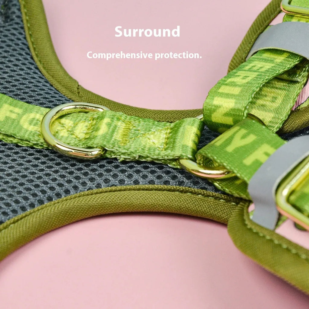 Adjustable polyester dog breast strap harness in Pink Avocado colour on a wooden surface