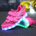Plum red children's sneakers with colourful LED lights on the soles and sides.