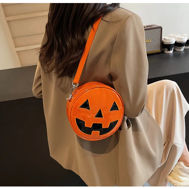 Small round pumpkin crossbody bag in PU, 18 x 18 x 7cm, shown in orange, black, and white