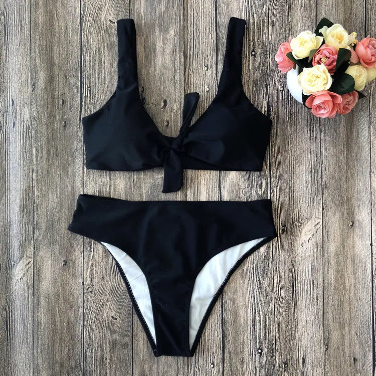 Women's solid colour bikini set in polyester with high-cut briefs, shown in wine red.