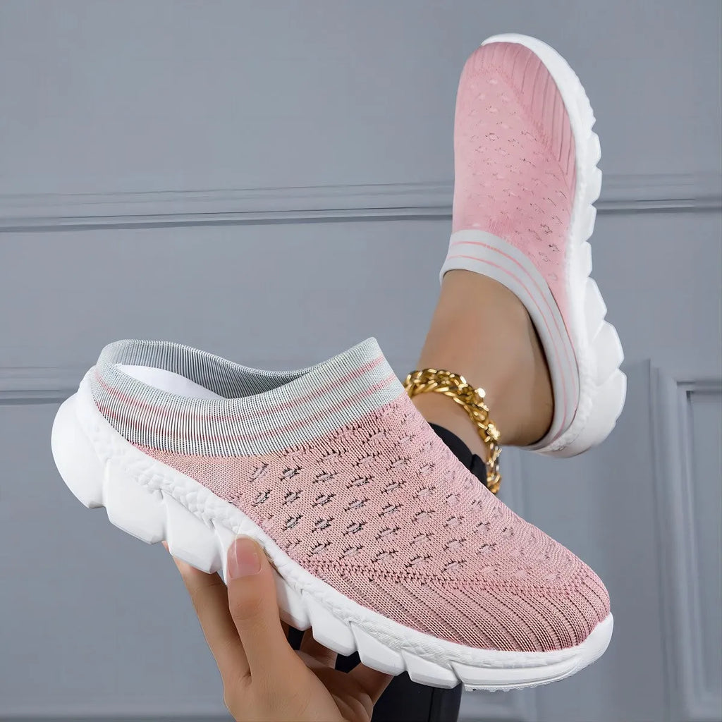 Women's Flyknit slipper shoes in a stripe pattern, showing hollowed-out design and sewing lines, on a viscose sole.