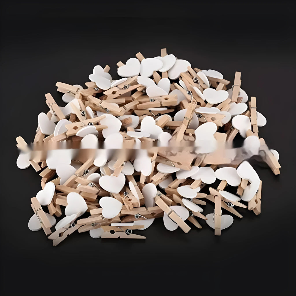 Five handmade wooden heart-shaped hair clips in red, pink, white, and yellow colours.