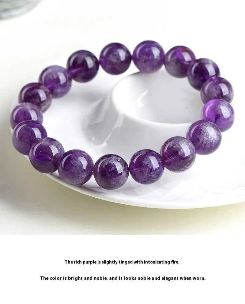 Natural feather amethyst crystal bracelet with scattered Snow Mountain purple beads and geometric Ruyi design.