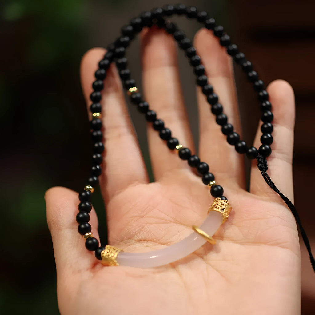 U-shaped Chinese style necklace with frosted black agate, white chalcedony, and 925 silver plating on a ball bead chain.