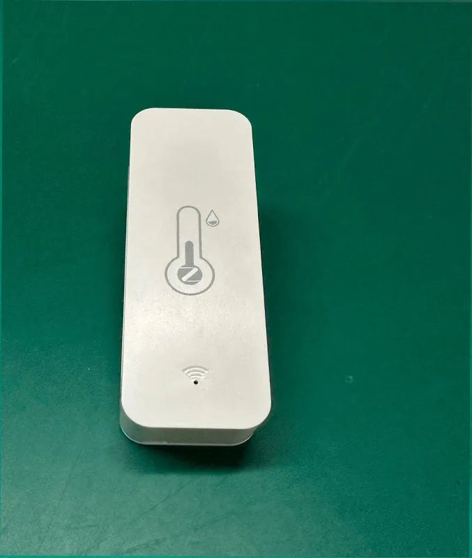Compact white WiFi and Zigbee temperature and humidity sensor for smart home monitoring