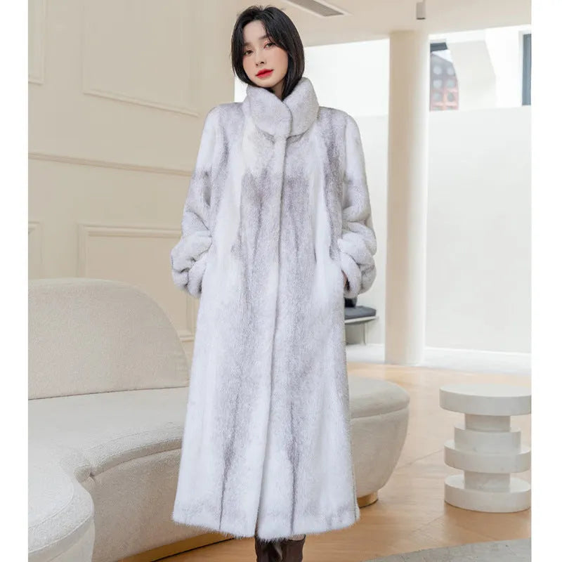 White faux fur coat with a stand-up collar and regular sleeves on a female model.
