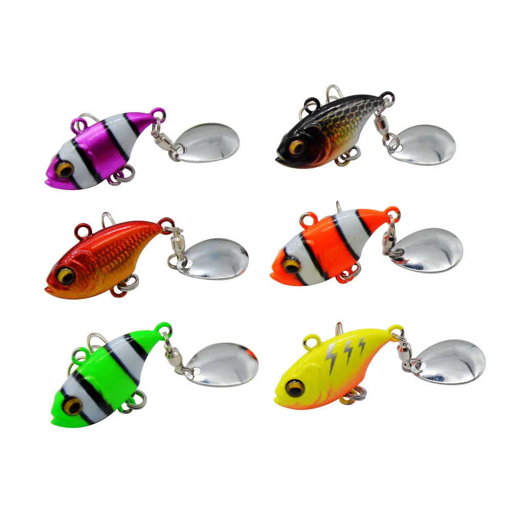 Metal sea fishing lure with a rotating sequin in zebra orange, mesh black, and gold colour variants.
