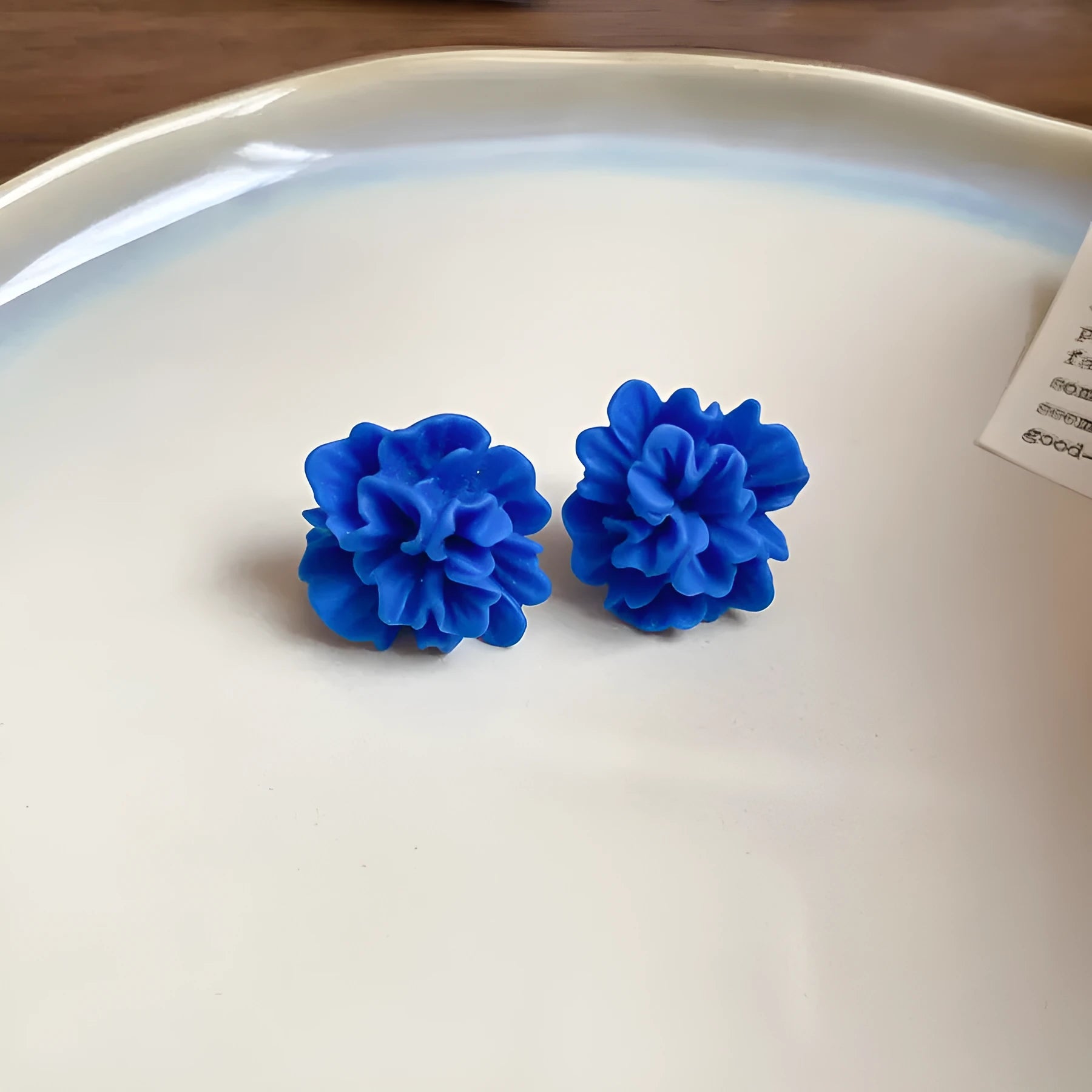 Geometric women's earrings with round elements and silver needle blue resin flower on cloth material