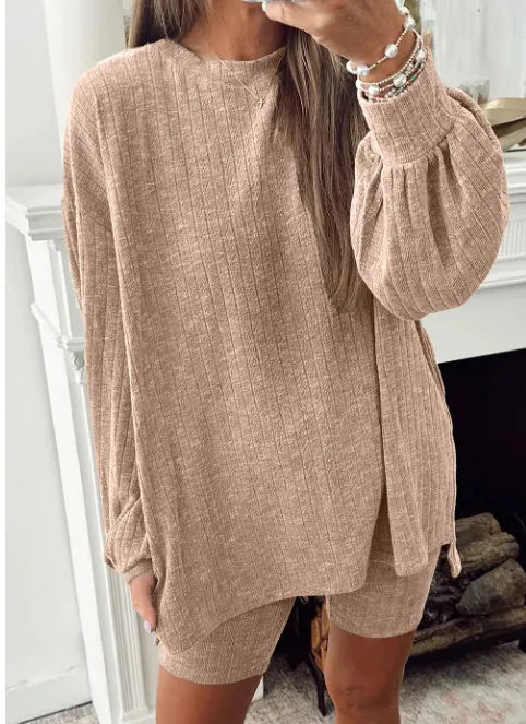 Dark khaki ribbed lantern sleeve sweater and motorcycle knit shorts set on display