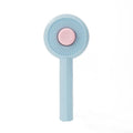 Blue and yellow pet grooming brush with metal pins and a self-cleaning button on the handle.
