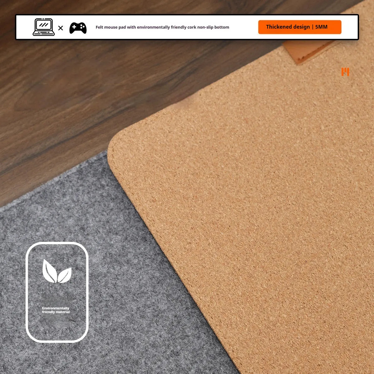 Oversized black and gray felt desk mat with cork base on a wooden desk