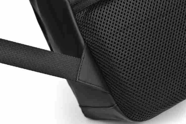 Men's large waterproof PU leather backpack in grey colour with visible stitching and laptop compartment.