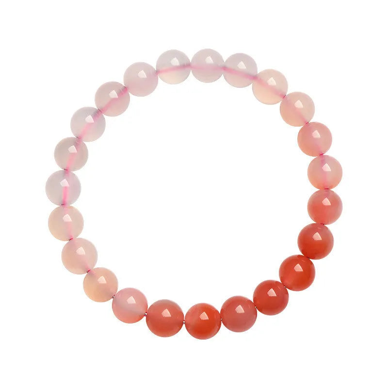 Yanyuan agate bracelet with gradient salt source coloured beads in a geometric shape on a wrist.