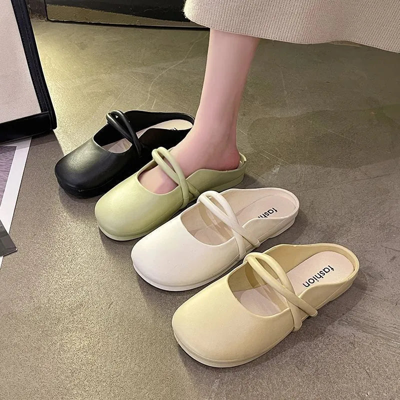 Women's black plastic flip flop sandals with enclosed Baotou front, shown on a white background.