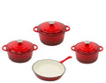 Cast iron enamel casserole set with frying pan and stew pot in light blue colour on a wooden table
