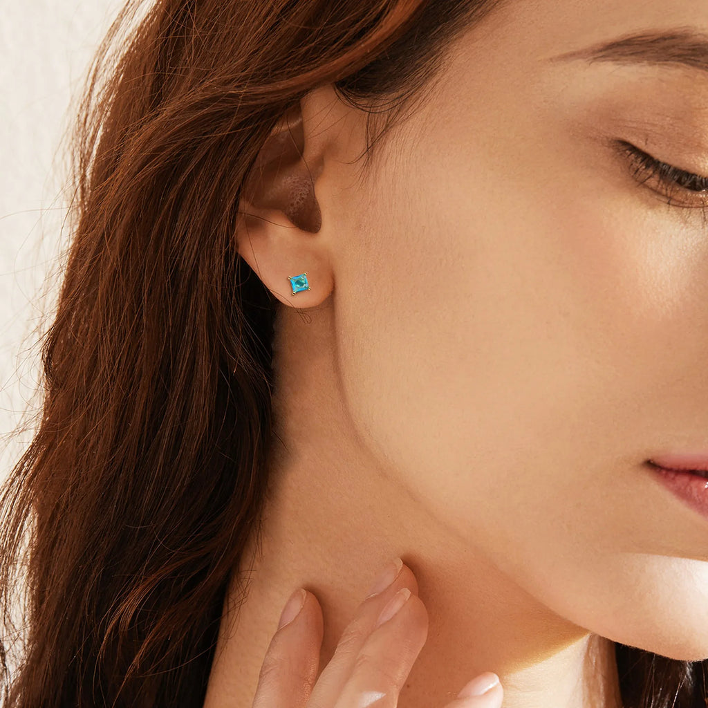 Gold-plated drop earrings with a pear-shaped zircon stone in a candy colour.