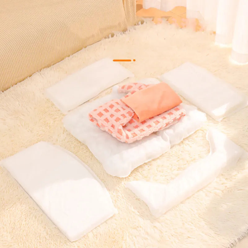Green triangular pet bed with thick sponge and a removable cover for cats.