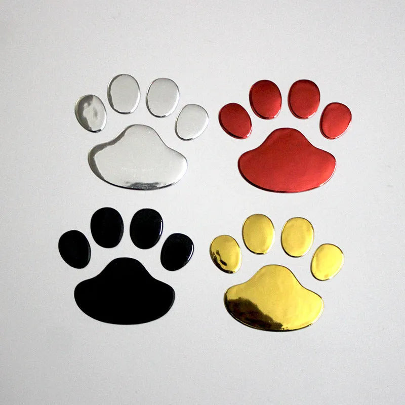 PVC car sticker shaped like a hand holding a brush, decorated with dog footprints pattern.