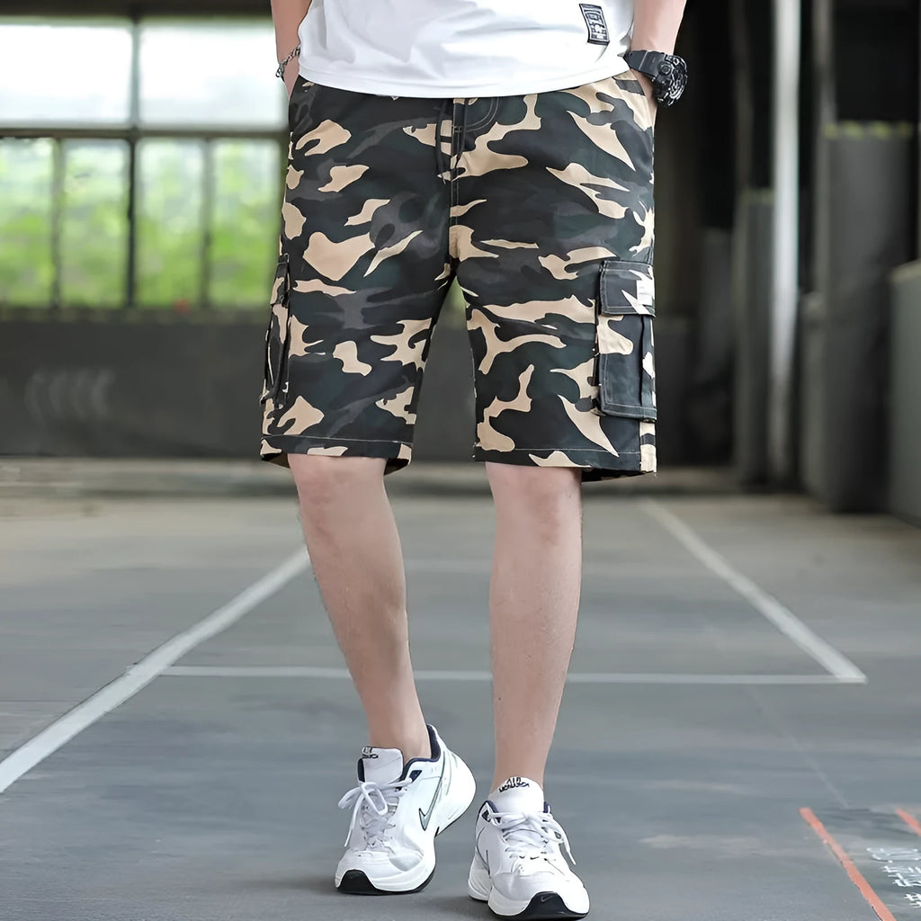Man wearing loose fit khaki Korean style cargo trousers with a slim silhouette.