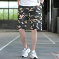 Man wearing loose fit khaki Korean style cargo trousers with a slim silhouette.