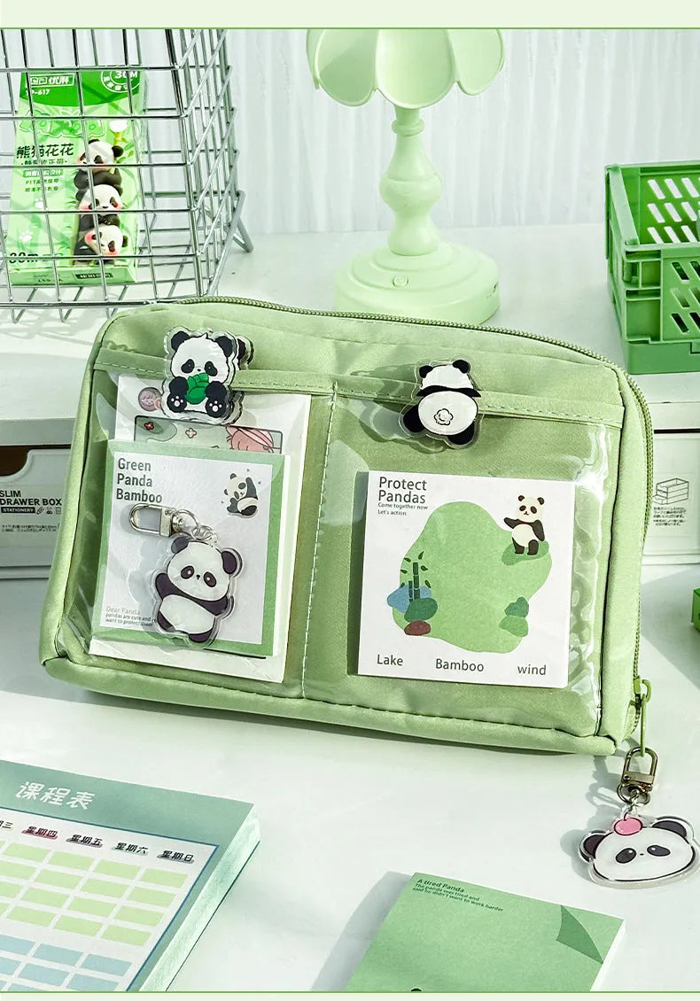 Green canvas pencil case with panda design featuring 12 internal layers for organising pens and stationery.