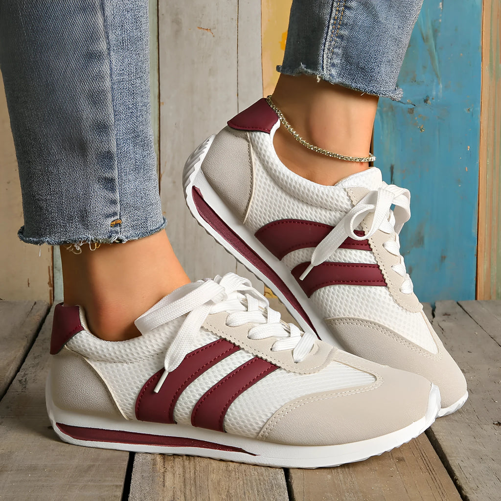 Wine red Cortez retro-style low-top sneaker with a cross-strap over a breathable mesh upper.