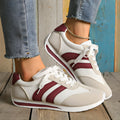 Wine red Cortez retro-style low-top sneaker with a cross-strap over a breathable mesh upper.