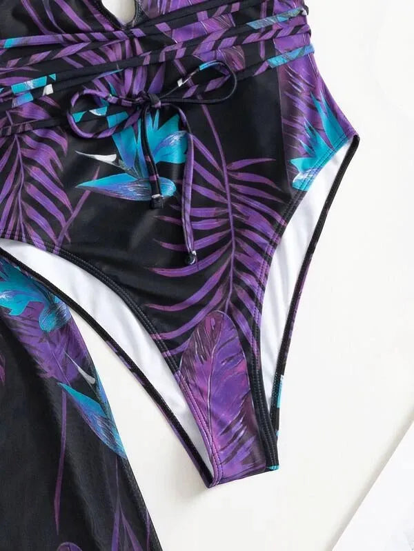 Women's three-piece polyester swimsuit bikini set with a matching coat in a pattern design.