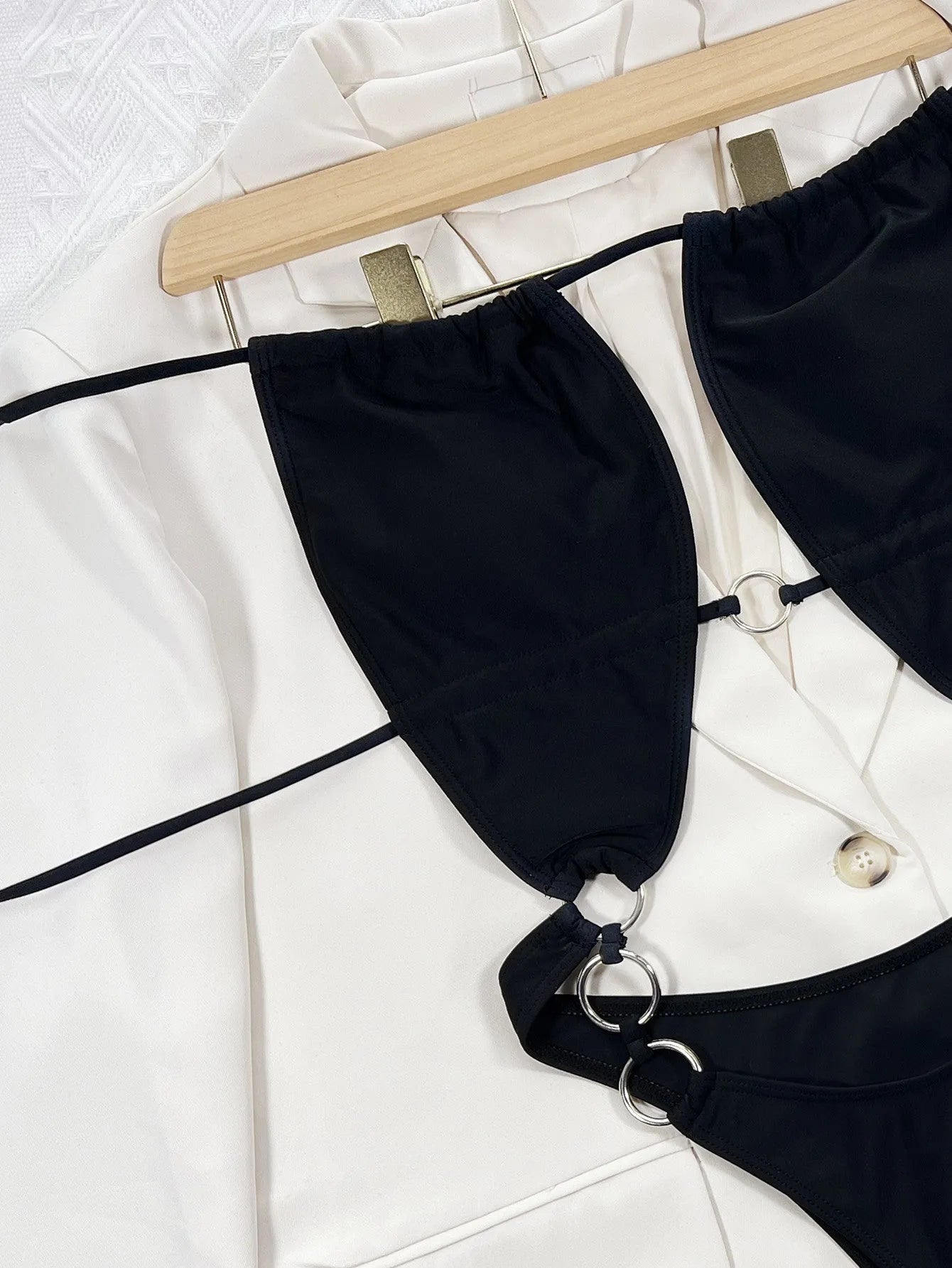 Black women's one-piece swimsuit with steel ring detail, sleeveless design