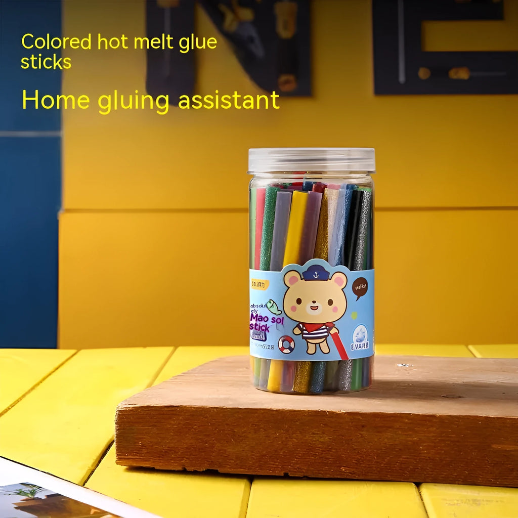 Pack of 55 clear hot melt glue sticks with 7mm diameter next to a glue gun.