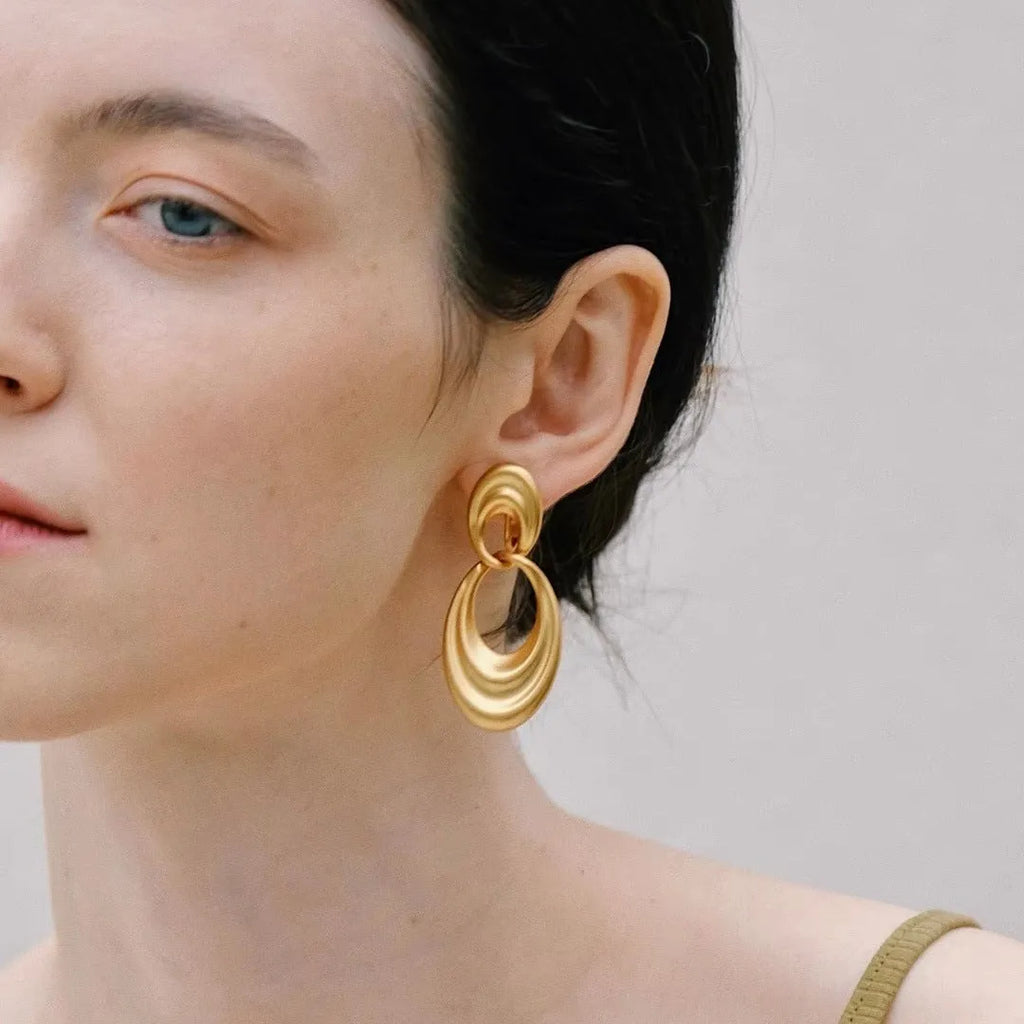 Gold French retro earrings with double circle design on U-shaped copper hoops