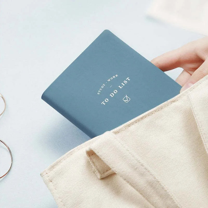Simple Style A6 notebook with PU cover in four colour options showing 96 pages of eye protection writing paper