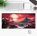 Large black anime-themed gaming mouse pad with non-slip rubber base on a wooden desk.