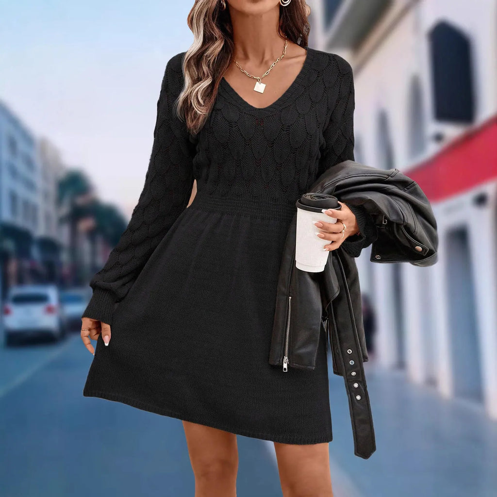 Retro ethnic style V-neck long sleeve dress in acrylic fabric on a hanger.