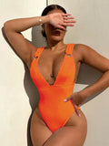 Women's solid colour one-piece swimsuit in black, white, green, or orange.